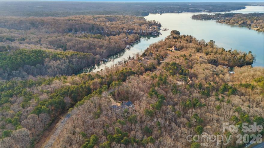 Tucked within the exclusive community of The Sanctuary, this rare 6 acre waterfront homesite offers the ideal canvas to create a custom retreat with a blend of privacy, nature, and luxury living. Set along a quiet cove of Lake Wylie, this property provides a serene backdrop to build your custom dream home, surrounded by mature trees and protected natural beauty. Enjoy access to world-class community amenities including a clubhouse, fitness center, pool, tennis courts, walking trails, and more—all designed to complement an active yet peaceful lifestyle. This is your chance to create a truly one-of-a-kind retreat in one of Charlotte’s most sought-after waterfront communities. The Sanctuary is known for its preserved landscape, estate sized lots and unmatched sense of privacy. Only minutes away from dining, shopping and Charlotte Douglas International Airport.