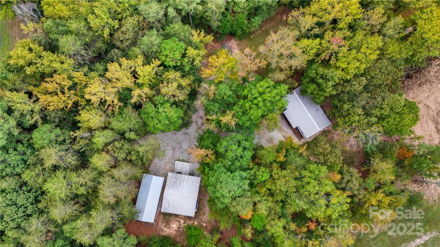 Escape to the tranquility of 6310 Four Knights Lane, Clover, SC! This captivating property offers a perfect blend of country living and incredible functionality on 3.43 beautifully wooded acres.

The comfortable home features 3 bedrooms and 2 bathrooms across over 1,200 sq ft, providing a warm, inviting atmosphere and immediate privacy. The sprawling lot is ideal for nature lovers and gardening enthusiasts.

The Ultimate Workshop & Outbuildings The highlight of this property is the site-built 30' x 30' heated garage/workshop. This robust space features 12-foot garage doors, making it perfect for:
* Woodworking
* Vehicle maintenance/storage
* Dedicated home gym or studio

The property also includes 30 & 50 Amp plugs for campers, multiple additional outbuildings, such as RV/Large Boat Carport, a well house, a landscaping shed, a dedicated carpenter's workshop, and a small storage shed for fuel/paint.

Located in the well-regarded Clover area, this property offers easy access to local amenities while retaining a true sense of secluded privacy. Don't miss this rare opportunity to own a move-in-ready home with the acreage and workspace you've always wanted!

Schedule your private tour today.