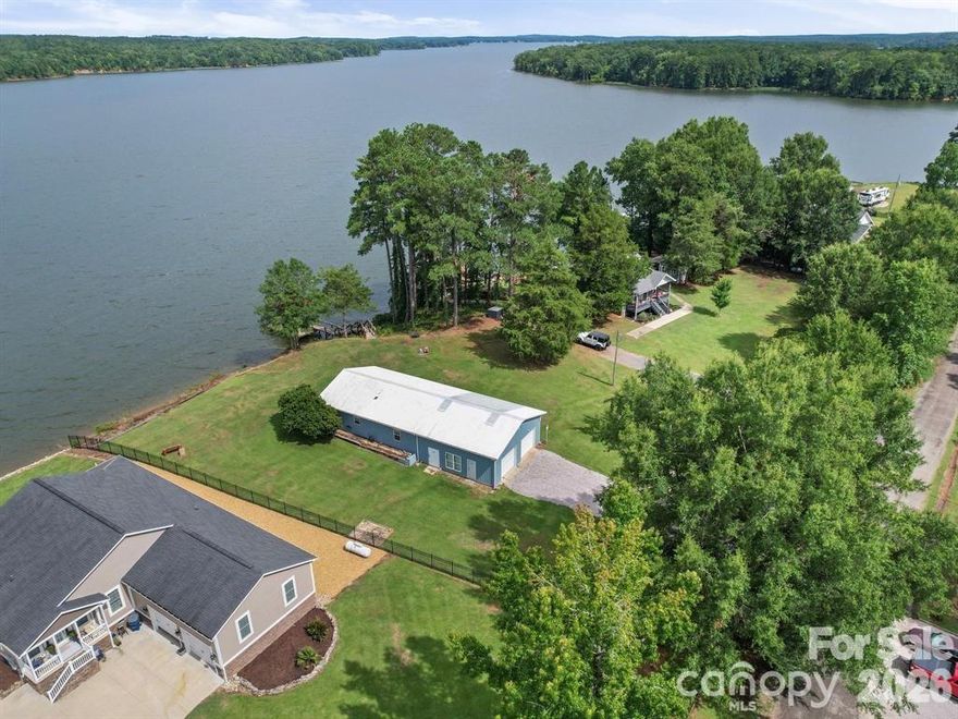 Welcome to your peaceful retreat on the main channel of Lake Wateree! This beautifully designed barndominium sits proudly on a sprawling, level lot with stunning views. Enjoy morning coffee or evening sunsets from your porch as the lake shimmers just beyond your backyard. 
Step inside to discover a warm and inviting open-concept layout, perfect for laid-back living or entertaining guests. The thoughtfully arranged floor plan offers two spacious bedrooms, a full bath, and ample natural light throughout.
Outside, the generous lot provides endless possibilities—whether it’s gardening, lake-day gatherings, or simply soaking up the serenity of nature. and wide-open skies above, this property blends country comfort with waterfront living. This home comes fully furnished, and the seller has a permit for a boat lift. Just moments away from the Wateree Heritage Preserve, this property offers a front-row seat to nature’s wonders—where wildlife roam freely across protected landscapes.