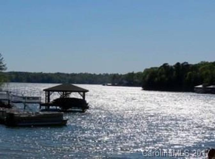 Waterfront home with sweeping views of the main channel and several levels of outdoor living all ready for your personal touch.