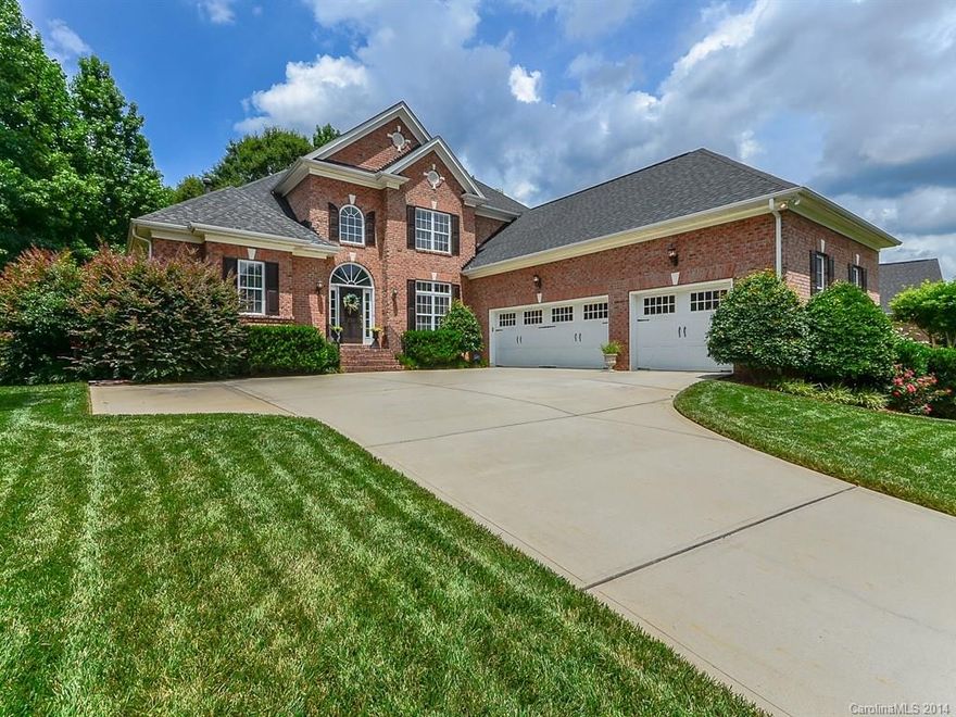 GORGEOUS Full Brick Home with Fantastic Outdoor Living Space!  Dream private back yard with pool & hot tub, stone paver patio, and courtyard.  Outdoor Kitchen with built in grill, frig & storage plus Upper & Lower Decks. Flowing open plan; luxurious Master Suite & Guest Suite on main level. Gourmet Kitchen with gas cooktop, double oven, granite, tile backsplash, Work Island, Brkfst Area & Bar. Media Room with surround sound. Private wooded setting moments to Charlotte!
