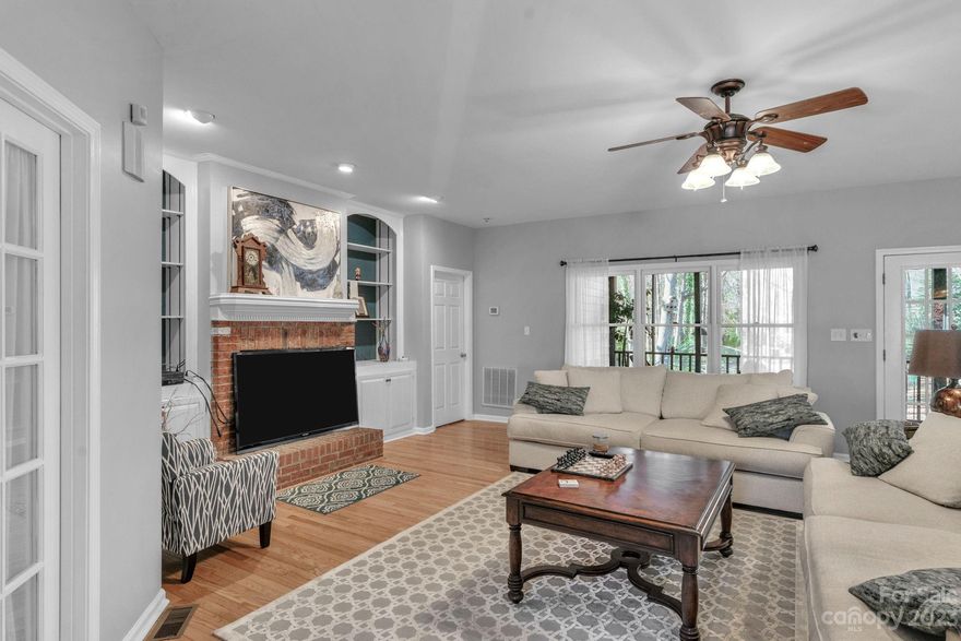 Discover your dream home in this 1.5 Story split bedroom plan, featuring a main-level office and primary suite for ease. Situated on a spacious nearly 1-acre lot just off 485, this prime location offers convenience. Embrace the potential of the open floor plan, relax on the screened porch, and enjoy the fenced rear yard. Upstairs, a versatile 4th bedroom with a full bath awaits—perfect as a bonus or media room. With good bones and unlimited potential, make it your own. A/C in the garage provides cooling for workspace. Sold AS-IS with no concessions; the seller will be present during showings, accommodating buyers as they explore the possibilities of their next home.