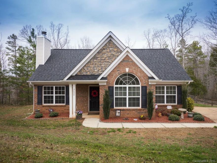 Come home to this adorable ranch home on 1.55 acres. Enjoy the privacy of the large lot and fenced backyard that backs up to the woods. Home features two car detached garage with plenty of storage up. Huge kitchen with tile floors, dark cabinets. Large sunroom with private view of backyard. Large great room with FP and hardwood floors. Big master suite features vaulted ceiling and walk-in closet.