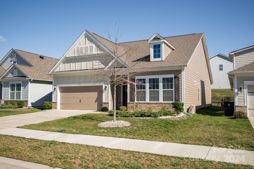 This charming home offers single-level living with a great floor plan. The entry hall leads to an open floor plan with dining area, great room with gas log fireplace, kitchen with stainless appliances (refrigerator included), gas range, island and breakfast bar, and breakfast nook with door to the covered patio overlooking a fenced back yard, perfect for relaxing. Split-bedroom with plan with 2 secondary bedrooms with a shared full bath adjacent, plus a wonderful primary suite that is quite spacious with a tray ceiling, huge walk-in closet, and bath with dual sink vanity, linen closet, water closet, and beautifully tiled shower with built-in seat. The large laundry room (washer & dryer included) has a utility seat and a convenient drop zone by the door to the 2-car garage. Lake access community on Lake Norman offers walking trails, pocket parks & ponds for enjoying nature, as well as amenities such as a pool, bocce ball court, playground & tennis. Come live the good life at LakeWalk!