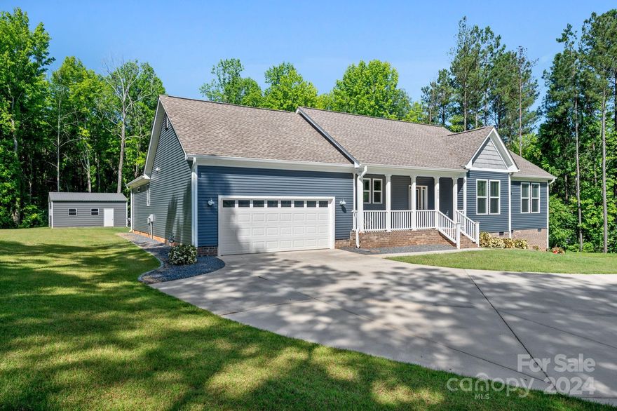 Gorgeous Ranch home, built in 2017 as builder’s personal residence. Perfectly set facing east on 2 country acres. Town of Van Wyck, 15 miles S of Ballantyne. Unique & inviting circle drive adds elegance, accessibility & flexibility. Ample parking for all your toys. This split bedroom, open floor plan home boasts 4 spacious rooms, one light & airy office & 2 elegant full baths. Spacious owner’s en suite is situated to the left side w/ private view of the yard & a finely finished owner’s bath. Right side of home hosts 3 addt'l lrg rooms & another elegant full bath. Splitting the owner’s retreat & secondary bdrms is an amazing entertaining space anchored by a gourmet kitchen w/ gorgeous granite countertops. Enjoy morning coffee & watch the sunrise on the front porch, & enjoy an evening tea or drink on the back deck watching the sunset. 240sqft deck & 554sqft patio. Lrg walk-in crawl w/ concrete pad. New 600+sqft storage building w/ lrg garage door. 3 bdrm septic. No HOA. Close schools.