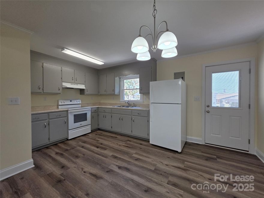 Come see this fully updated 2 bedroom, 1 bath unit in peaceful Rockwell. The kitchen has newer appliances and kitchen cabinets. Durable LVP flooring has been installed throughout all living areas. There are 2 good sized bedrooms, one bathroom and a laundry closet. Home is on a quiet street and has 2 allotted parking spots per unit. Lawncare and landscaping included in rent. This hidden gem won't last long.

No Smoking. Small pets accepted on a case by case basis. Deposit starting at $1075 (pending strength of application).  Tour home at your convenience without having to make an appointment. Register with Rently for the lockbox code. All applications must be submitted online on our website. Each adult applicant 18yrs and older living in the home will be required to pay a $65 non-refundable application fee.