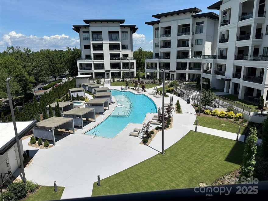 Luxury meets lifestyle in this 4th-floor Watermark condo in the heart of Cornelius. This 3 bed, 3.5 bath residence spans nearly 3,000 SF with high-end finishes, hardwood floors, gas fireplace, and an open-concept layout. The chef’s kitchen impresses with Wolf and Sub-Zero appliances, oversized island, walk-in pantry, and beverage fridge.

Enjoy resort-style pool views from expansive covered and uncovered lanai spaces, perfect for entertaining or relaxing. The spacious primary suite features private balcony access, a large walk-in closet, and a spa-inspired ensuite with dual vanities, soaking tub, and a luxurious steam shower. Additional highlights include a wet bar, office/flex space, and private elevator access.

Two assigned garage spaces are ideally located next to the unit’s walk-in storage. Gated community amenities include a saltwater pool, hot tub, clubhouse, fitness center, putting green, and more—all just minutes from Lake Norman, marinas, restaurants, and shopping.