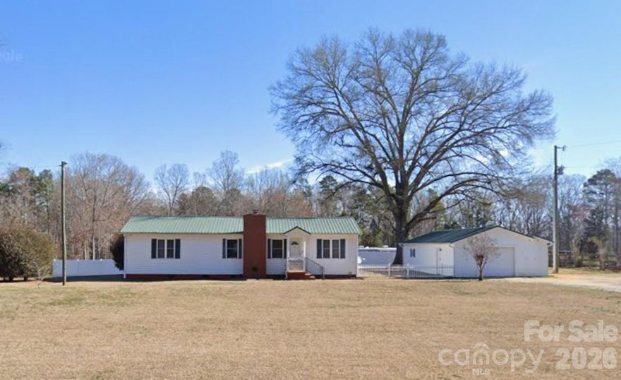 Tucked away in the quiet countryside of Rock Hill. this inviting 3-bedroom, 2-bath home offers the kind of space and layout that just works. The open floor plan flows effortlessly, with a kitchen that features a functional island and breakfast bar overlooking the living and dining areas, all highlighted by a vaulted ceiling that adds to the sense of openness.

The living room centers around a cozy gas-log fireplace, perfect for winding down at the end of the day. Step outside to a spacious covered deck made for both entertaining and enjoying a little peace and privacy, with partial fencing already in place.

Car lovers, hobbyists, or anyone tired of fighting for garage space will appreciate the massive 975 sq ft garage, fully wired and ready to go. Add your own personal touch and you’ve got a property that delivers comfort, function, and a little breathing room from the chaos of everything else.