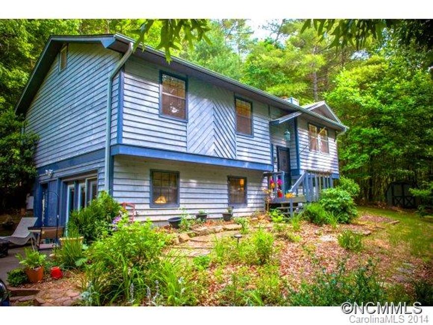 Double master bedrooms, one with walk-in closet. Both with master baths attached. 3 Bedroom WITH BONUS room with closet. Secluded wooded lot  is great to relax and entertain with wrap-around back deck with setup for a built-in firepit. Super convenient location, easy commute to asheville or shop and eat on Main St in Weaverville. Extremely affordable HOA dues to maintain roads and snow removal in winter. Amazing Value, check it out for yourself!