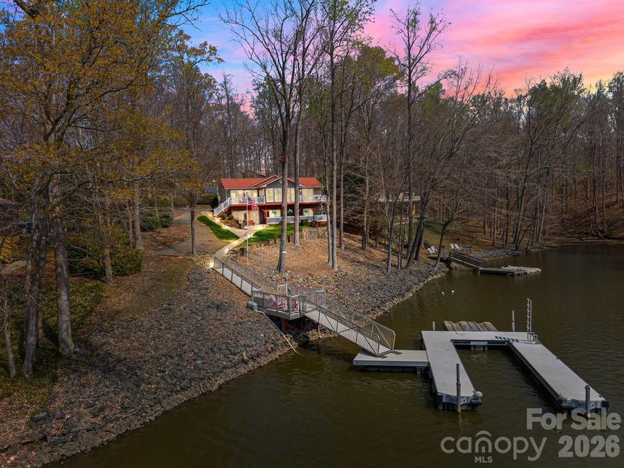 Experience lake living at its finest with this stunning waterfront property on the Lexington side of High Rock Lake. Designed for both relaxation and entertaining, this home features a detached two-car garage, storage shed, private dock and pier, and a spacious yard perfect for summer gatherings and outdoor fun. Inside, you’ll find a bright and open floor plan with a generously sized kitchen, dining area, and living room that flow seamlessly together. The main-level primary suite offers convenience and comfort, complete with a full ensuite bathroom. The fully finished basement expands your living space with two additional bedrooms, a full bathroom, and a versatile living area—ideal for guests, recreation, or a private retreat. This home truly captures the essence of lake life and is ready to become your dream getaway or full-time residence.