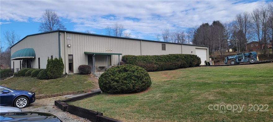 LOCATION!  Warehouse / Manufacturing building in Mills River.  Just south of Arden on Brevard rd.  2 miles from the Asheville Airport.  2.72 acre site.  Approximately 10,500/sf building with 18' ceiling height in center and 16' on the sides.  About 3,500/sf of finished office space on 2 levels.  Additional 4,875/sf covered shed, open on 2 ends.  984/sf metal shed.  This building is currently a welding and metal shop.  Many possibilities here such as a distribution warehouse, manufacturing, storage, etc.  Has 4 ground level roll up doors.