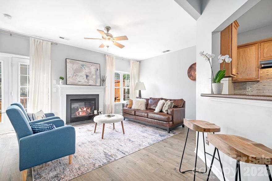 This attractive 3-story townhome is located in the sought-after Oakhurst neighborhood. The entry level features a 1-car garage with storage, a laundry area, and a versatile flex space/room and a half bath, ideal for a home office or guest space. ***Recent updates include new carpeting (2026) on the stairs and third-floor hallway, plus HVAC replaced in 2024 with a 10-year warranty, and two new ceiling fan lights.***The second floor offers open-concept with a gas fireplace, spacious living and dining areas, a well-appointed kitchen, and a convenient half bath. Step outside to a large sun-drenched deck, perfect for morning coffee or effortless entertaining. Upstairs, the top floor serves as a private retreat. The primary suite features a vaulted ceiling, a walk-in closet, and a private en-suite full bath with double sink vanity. Two additional bedrooms and a hallway full bath provide flexibility for guests, family, or hobbies. Residents enjoy access to community amenities including a pool, tennis/sport court, and green space; all while being conveniently located near shopping, dining, healthcare, and major routes. ***Washer/dryer and refrigerator convey. Dining room light fixture excluded. ***Interested in HOA details? Your agent can provide the information, or feel free to reach out directly if you're unrepresented. ***For information on upcoming development projects, visit the Town of Cornelius website.