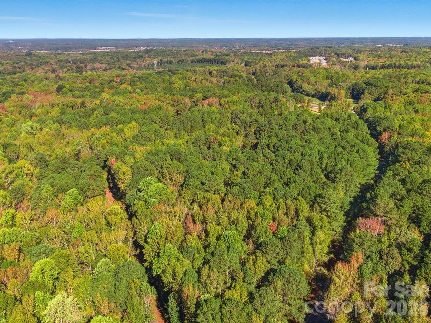 Discover the perfect opportunity to build in one of Waxhaw’s most desirable areas. This beautifully wooded 2.4-acre lot offers mature trees, gentle topography, and the potential to subdivide for two homes. Enjoy the peaceful natural setting while being just minutes from historic downtown Waxhaw, known for its charming shops, dining, and community amenities. With paved road access and a scenic backdrop, this property provides a rare combination of privacy and convenience — ideal for creating your custom home or investment project.
Perc test was completed 03/14/2026 and is located in the additional documents