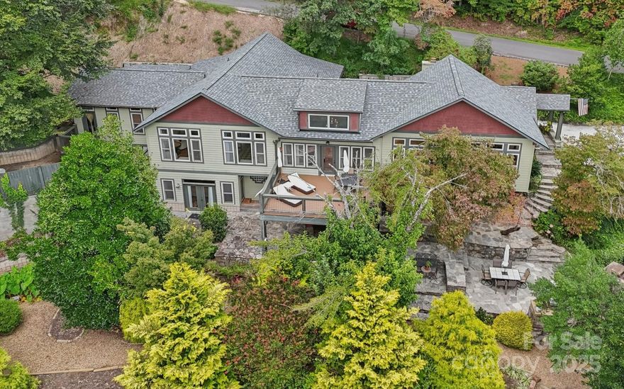 Hollywood glam meets the mountains at 193 Gateway Drive in Rumbling Bald on Lake Lure. This extraordinary home spans nearly 6,000 square feet and is designed to impress at every turn. Positioned along the Bald Mountain golf course and steps from resort amenities, it combines dramatic architecture with resort-style living. 

Inside, soaring ceilings and walls of glass create a breathtaking great room anchored by a grand stone fireplace. The chef’s kitchen offers professional appliances, custom cabinetry, and an oversized island perfect for entertaining, flowing seamlessly into spacious dining and living areas. The primary suite is a true sanctuary, featuring dual boutique-style walk-in closets, spa-like baths, and space designed for both rest and indulgence.

Beyond the bedrooms, the home surprises with a private spa wing boasting an indoor lap pool, red-light sauna (negotiable), and personal gym. A lower-level studio with kitchenette provides flexibility for guests, in-laws, or rental income. Multiple bonus rooms, a home theater, and expansive gathering areas ensure every need is met — from quiet retreats to festive celebrations.

Outdoor living is equally impressive: custom stone cook center, integrated fire pit, decks for dining and lounging, game shed, and a private hot tub under the stars. The setting blends curated landscaping with the beauty of the Blue Ridge Mountains, delivering year-round enjoyment from sunrise coffees to sunset gatherings.

Ownership here also means access to all Rumbling Bald Resort amenities: two championship golf courses, private beach and marina, restaurants, pools, tennis, pickleball, spa, fitness center, and miles of trails. Lake Lure itself is a destination of shimmering waters and mountain vistas, convenient to Asheville, Charlotte, and Greenville yet worlds away from the ordinary.

Whether envisioned as a full-time residence, a vacation retreat, or a proven income-producing rental, 193 Gateway Drive is a property without compromise. With space for over a dozen guests, unmatched amenities, and a setting that inspires “wow” at every corner, it offers not just a home but a lifestyle to be treasured for generations.

Notes:  All Hurricane Helene storm damage repair has been completed with all documentation available upon request. Successful short-term rental with financials available upon request. Search airbnb for "Rumbling Bald Resort 6000+ Sqft Villa w/ Lap Pool" for all the amazing reviews! Originally built in 1974 but "effective" year with new CO is 2010. Furniture is negotiable.  Lake Lure projected date to be full pond is May 1, 2026! 2025 HOA dues $4854/year and one time capital fee of $10,000 due at closing.