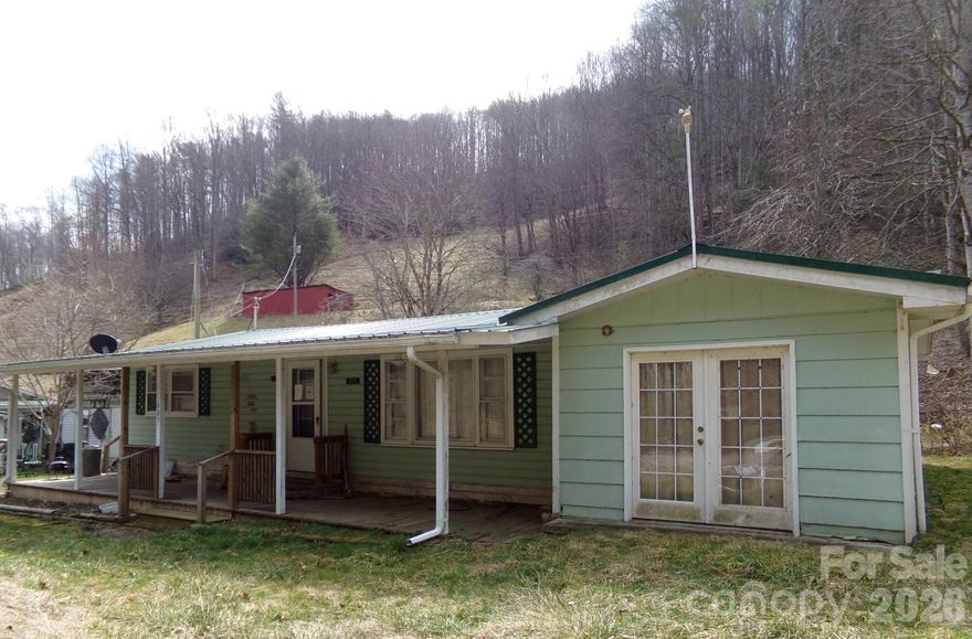 Enjoy one level living with this ranch style home. Relax on the front porch overlooking a babbling creek. Home sold as is with no representations by seller or broker. Buyer is advised to discover and confirm any and all information included this listing and in regards to the property.