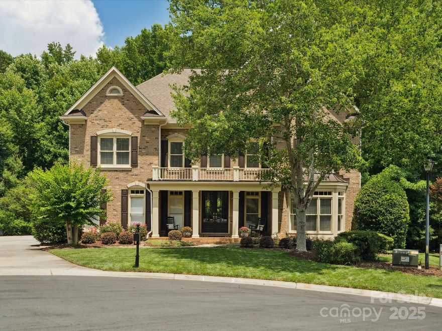 Beautiful 3-story all-brick home nestled on a private nearly ½-acre cul-de-sac lot in the highly sought-after Brookhaven community. The light-filled interior features a wonderful home office, formal dining, and family room with a stone fireplace. Gourmet kitchen includes top-tier appliances, a 5-burner gas cooktop, a large island, a butler’s pantry/wet bar, beverage center, and a sunlit breakfast bay. The luxurious primary suite offers a serene retreat with a cozy sitting area, spa-inspired bath, custom closets, and a private yoga/retreat/dressing room. The expansive 3rd floor is ideal for epic movie nights & everyday living, featuring a huge recreation room,  a flex room (6th BR/exercise/craft), and is plumbed for a wet bar. Outdoor living is just as impressive, with a screened porch, an updated Trex deck, and a flat yard backing to a peaceful wooded view.  3-car garage, hardwood floors, numerous updates. Neighborhood resort-style pool, tennis courts. Aligned with top-rated schools