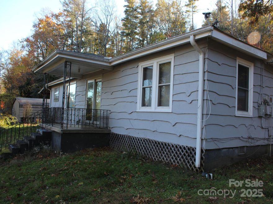 Cute rustic cottage ready for some renovation but not in bad shape--kitchen and bathroom need the most updating and it needs a heat source since the current one is not working.   Estate sale so sold "as is".  Nice covered porch on side plus covered front entrance. Newer metal 2 car garage detached building/workshop plus a detached carport. Well is shared .  Lots of possibilities and priced for quick sale.
