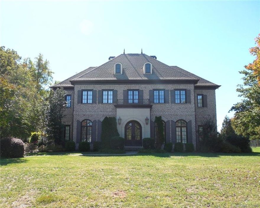 Stunning brick home w/beautiful architectural features including deep moldings, tray ceilings, coffered ceilings, wainscoting. Beautiful wood flrs,  wonderful custom closets throughout, upscale baths. Open floor plan, gourmet fully equipped kitchen w/island, fantastic pantry, charming GR w/fpl, elegant dining and living rooms, spacious master. Upper level has family room with fpl, rec rm, media rm, & 3 BRs. Enjoy outdoors-1.49 Ac, in-ground pool, fenced, screened porch. Being sold "as is."