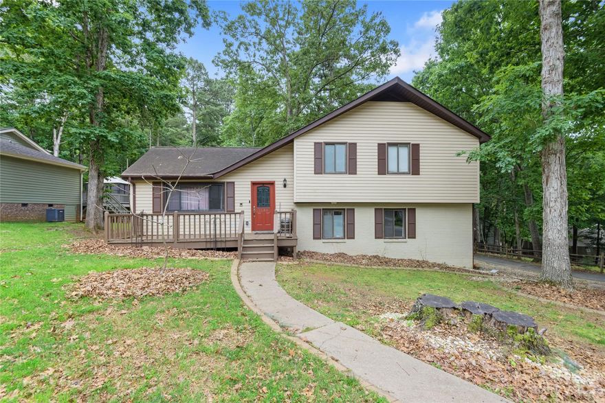 Price change!! Sold AS IS!!
Welcome home to the quiet lake community of Tega Cay. This beautiful home is within walking distance of Tega Cay Golf and Country Club. Amenities include lake access, a membership available pool, golf cart-friendly roads throughout the neighborhood, several parks within walking distance of the home, and community events. The country club has a restaurant and bar that are open to all. This home is zoned for Tega Cay Elementary in the award-winning Fort Mill school district, and the bust stop is 2 houses up the street. This home features new French doors in the kitchen and in the den, a newly installed tankless water heater, and a new whole house carbon filter as well as a new rear deck with a polycarbonate roof. A new roof was installed in 2015.