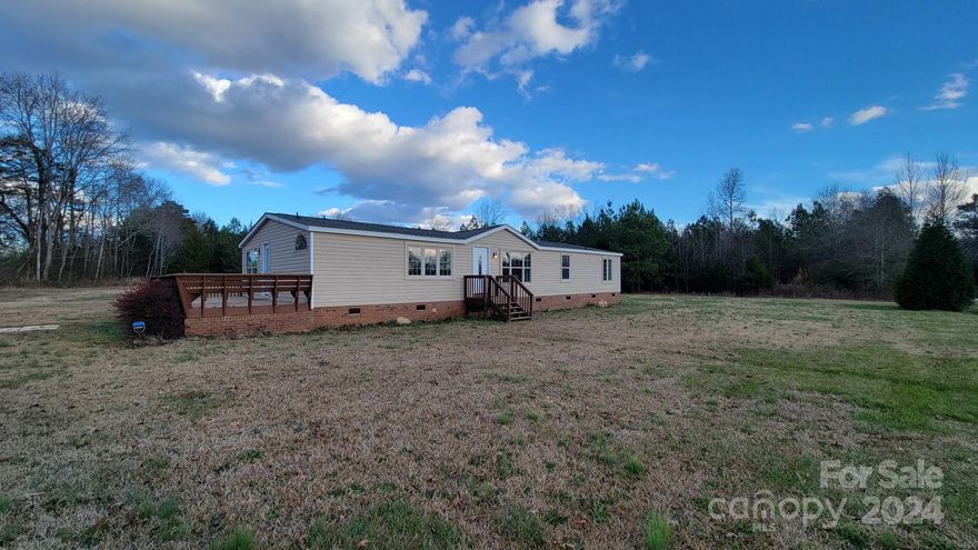 This is a wonderful split-floor plan home located in the highly desirable Buford school district. With 5 bedrooms and 3 full bathrooms, this house has undergone a complete renovation and is now ready for you to move in. The property sits on an open acre of land and offers endless possibilities, from raising chickens to hosting outdoor parties around the firepit. The lot also features a large wired utility shed, providing ample space for your storage needs. The house has been completely updated in 2021, including the roof, HVAC, water heater, paint, flooring, bathrooms, and kitchen, which boasts a beautiful farmhouse sink. The siding and brick skirting have also been updated. This home is move-in ready, and the washer, dryer, and refrigerator are all included. Don't miss out on this amazing opportunity to own a beautiful home in Buford! All it needs now is you!
