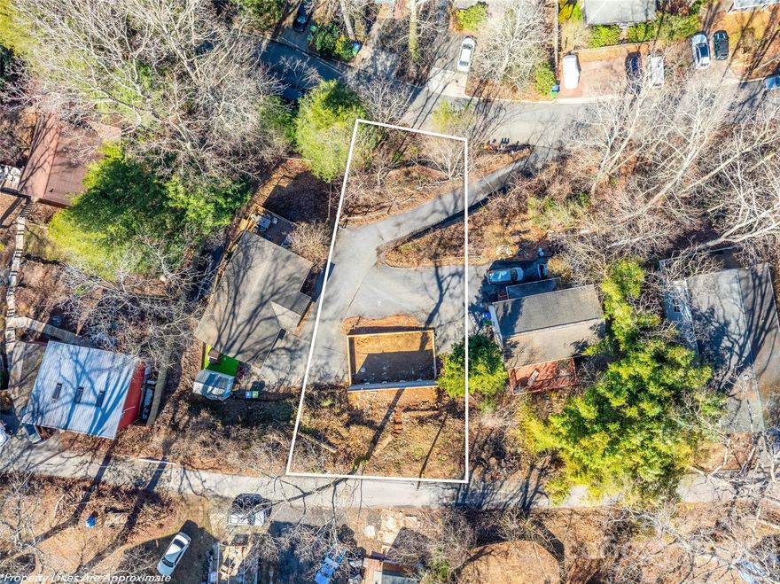 Situated in the highly sought-after Montford Hills neighborhood, this 0.18-acre lot offers the ideal canvas for your dream home. With existing utility stubs for water, sewer, power, and internet, it’s almost ready to build! The sloped terrain leads up to a flat building area that offers beautiful potential for second-story views. A paved, shared driveway provides easy access to the property.  Enjoy living in an established and sought-after city neighborhood, with convenient proximity to everything you need so you can live the lifestyle you want!
