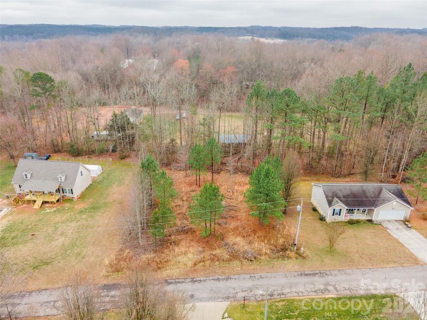 Looking for the perfect spot to build your dream home? This beautiful, .46 acre partially cleared lot offers a quaint country setting that is still highly accessible! Located on a cul-de-sac with no through traffic. It is a true blank canvas, ready for your custom construction or a modular home - Minimum build of 1000 sq ft. County water is available (standard tap fee applies); private septic is needed. This lot has been previously approved for a septic permit but now expired. Don't miss out on this peaceful slice of the countryside! Don't let this prime piece of real estate slip away! 

Level lots in this area go fast. Grab your builder, walk the property today, and call Shelley Arthur at 704-325-5864 to inquire before it's gone!