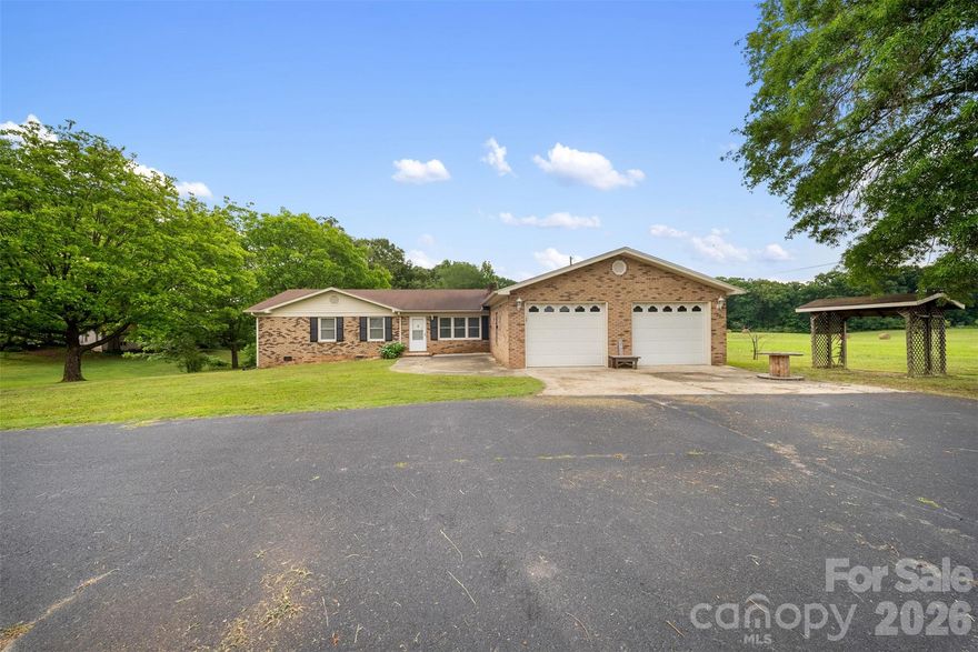 Welcome to this peaceful property situated on a spacious lot. This unique property features storage buildings and tractor sheds with electricity- ideal for equipment, hobbies, or small-scale agricultural use. The large backyard provides plenty of room for outdoor enjoyment!

The charming brick home includes a versatile flex-space room that can serve as an office, playroom, craft space or additional living area. The property is being sold as-is, giving the next owner an excellent opportunity to update and personalize it to their own vision.