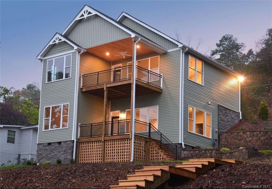 Brand-new!  Just completed! Unbelievable expansive view of the main channel! Big Water, Big View! Cathedral ceilings, master on main, white kitchen cabinets with gray & white granite countertops. Totally stylish with decorator colors throughout. Nice, big open great room with large picture windows in both the great room and family room downstairs. Tall ceilings in lower level with lots of glass. 2 nice covered porches on both levels and brand new 2-slip boathouse.