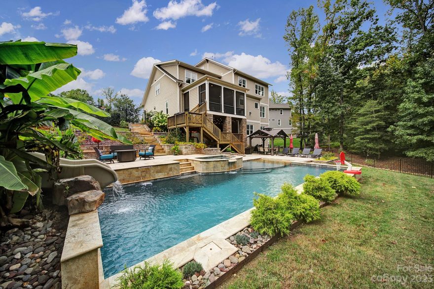 Don’t miss out on this spacious home in highly sought after Springfield neighborhood! Main level includes a study with custom barn door, formal dining room, large gourmet kitchen that opens up to the great room, and a guest room with full BA. Out back you'll find a resort style in-ground salt water pool with, spa, and built in slide. Gorgeous primary suite on the 2nd floor, 3 secondary BRs, 3 full BAs and an additional BR/Bonus room. Fully finished basement also offers an additional BR/BA, rec room and utility room. That's 7 BRs offered in this amazing home. Wonderful location on cul de sac street. Springfield is an amenity rich community with on- site community manager, 6 tennis courts, pickle ball, 3 pools, walking trails, playgrounds, parks and more! Anne Springs Greenway is located just across the street, and BONUS! membership is included with HOA fees! What more could you ask for? Book your showing today!