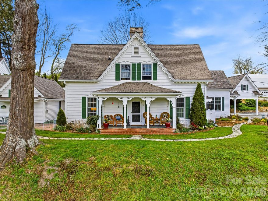 Nestled on six picturesque acres featuring a double pond with tranquil waterfall, this gracious estate is anchored by a 3,200+ sq. ft., renovated 150+ year-historic main residence that perfectly blends the "charm of an old farmhouse with modern conveniences". The property includes fully furnished 2/1 and 1/1 cottages, plus a 3,000+ sq. ft. barn equipped to house horses,(currently goats, donkeys and chickens) with possibility for conversion into additional rental units. This idyllic retreat holds incredible potential, whether you want to continue its legacy with turn-key cottages with rental record, transform it into a stunning Bed & Breakfast or create your family homestead in the gorgeous WNC mountains.