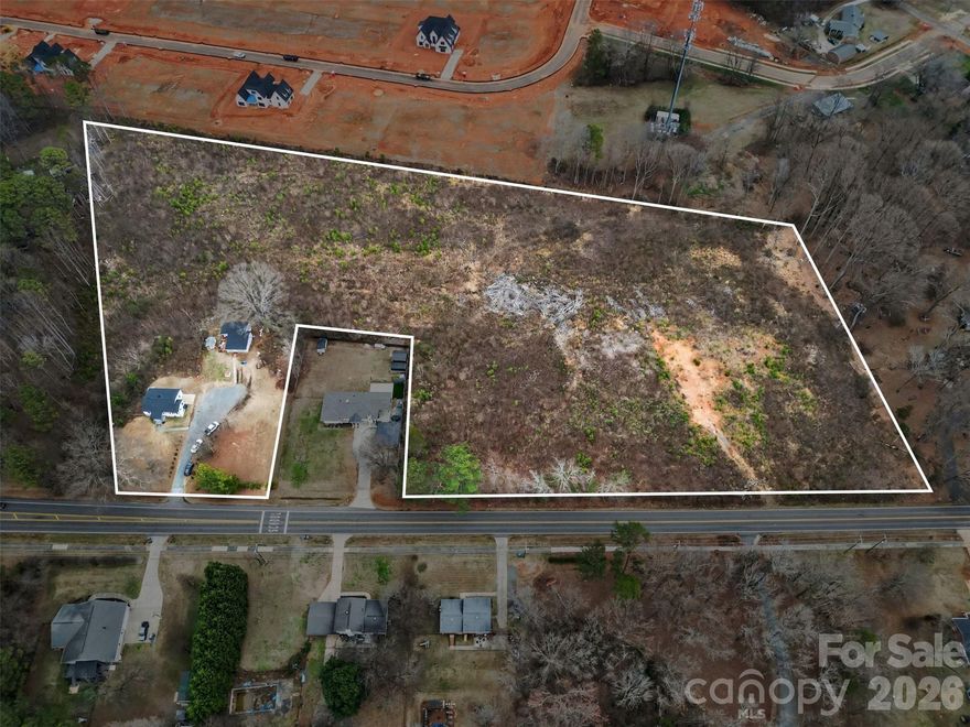 11733–35 Idlewild Road offers approximately 10 acres in a high-growth area of Matthews where large contiguous tracts are increasingly limited. This is a strategic acquisition for builders and developers seeking scale in a strong residential market. The property includes two existing homes that do not contribute value and are being sold as-is. The site is best suited for redevelopment. A newly constructed residential community directly behind the property highlights strong momentum and buyer demand in the immediate area. Convenient access to Mint Hill and Charlotte, along with nearby shopping, dining, and schools, parks, and supports long-term residential demand. Road frontage and accessibility further enhances development potential. Ideal for a small subdivision, estate lots, or a phased residential community, this offering represents a rare opportunity to secure scale in an evolving corridor. Schedule a tour today!