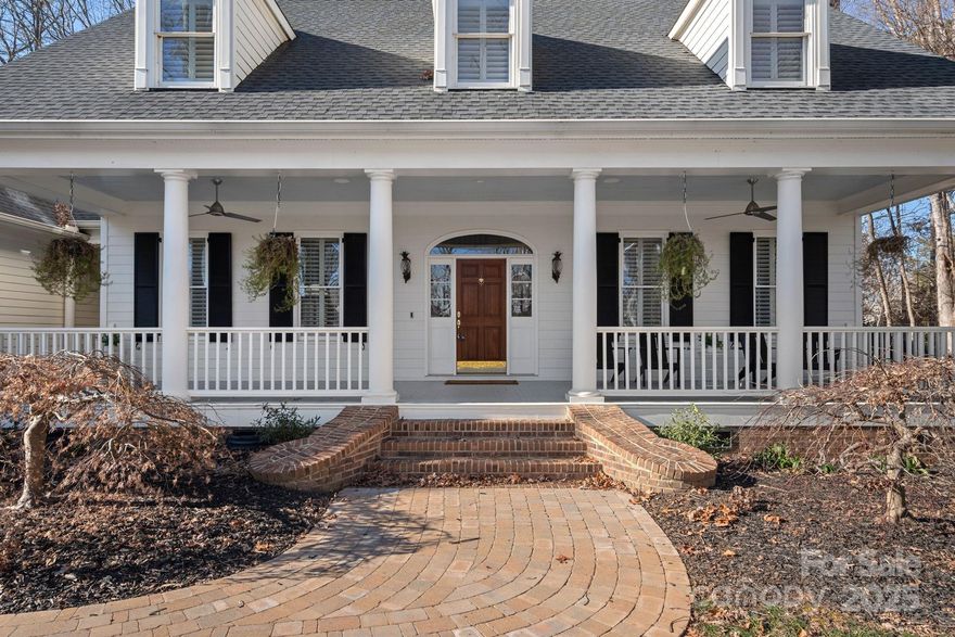 Freshly remodeled in 2023, this 4-bedroom, 3.5-bath home in The Point’s main village offers timeless elegance and a DEEDED BOAT SLIP within walking distance. The gourmet kitchen features two expansive islands and abundant custom cabinetry, perfect for hosting. The open layout between the keeping room and kitchen creates a welcoming space for easy living, while the flexible main-floor layout adapts to your needs. The main-floor primary suite boasts a stunningly renovated bath for your private retreat. Enjoy the Hot Springs Grande spa hot tub just off the primary bedroom. New wide-plank hardwood floors and a Sonos sound system add modern comfort. Relax on the front porch overlooking the LAKE VIEW, or unwind on the new back deck. The professionally landscaped yard offers privacy, with an undeveloped septic repair lot behind ensuring no future builds. Conveniently close to the club and amenities, this home is the ideal blend of charm, luxury, and ease.