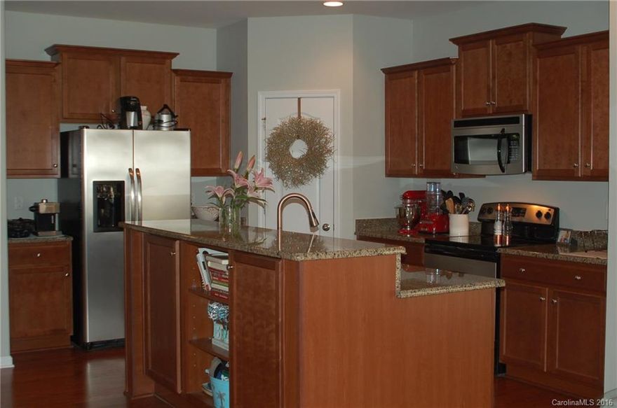 Beautiful 2-story Townhome with hardwood floors, granite counter-tops, and stainless steel appliances. The fenced in patio is a nice private place to relax. Basic cable & internet included! Fantastic Ballantyne location.