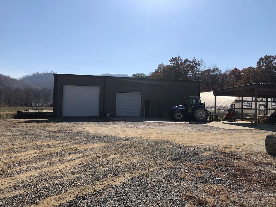 Presenting a prime opportunity at the heart of Cane Creek Road, this property boasts 2.72 acres of land with open use zoning in Buncombe County. 
Featuring a versatile 2400sf warehouse complete with loading docks, roll-up doors, and a walk-in cooler, the site also includes a utility shed and two greenhouses among its offerings.
With well and septic hookup required, the possibilities for this property are endless, from flex warehouse use to farming with Open Zoning.
Situated between the vibrant areas of Fletcher and Fairview, North Carolina, this location offers convenience and potential for a variety of business endeavors. 
The property's advantageous positioning directly on Cane Creek Road ensures easy access and visibility. 
Don't miss out on this exceptional opportunity to acquire a property teeming with potential in a desirable location.
***
Survey dated January 2023 from previous land sale.