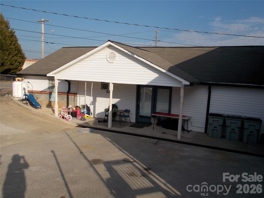 Great Investment opportunity!  Full Garage with lift and compressor was once an successful upholstery shop on a corner lot and 4 lane highway, tons of traffic, Would be a great car lot or Mechanic shop, Paint booth in a building behind shop, 2 detached garages, 2 apartments, One studio with 1 bedroom and 1 bath, the other is 2 bedroom 1 bath, Schedule your showing today!