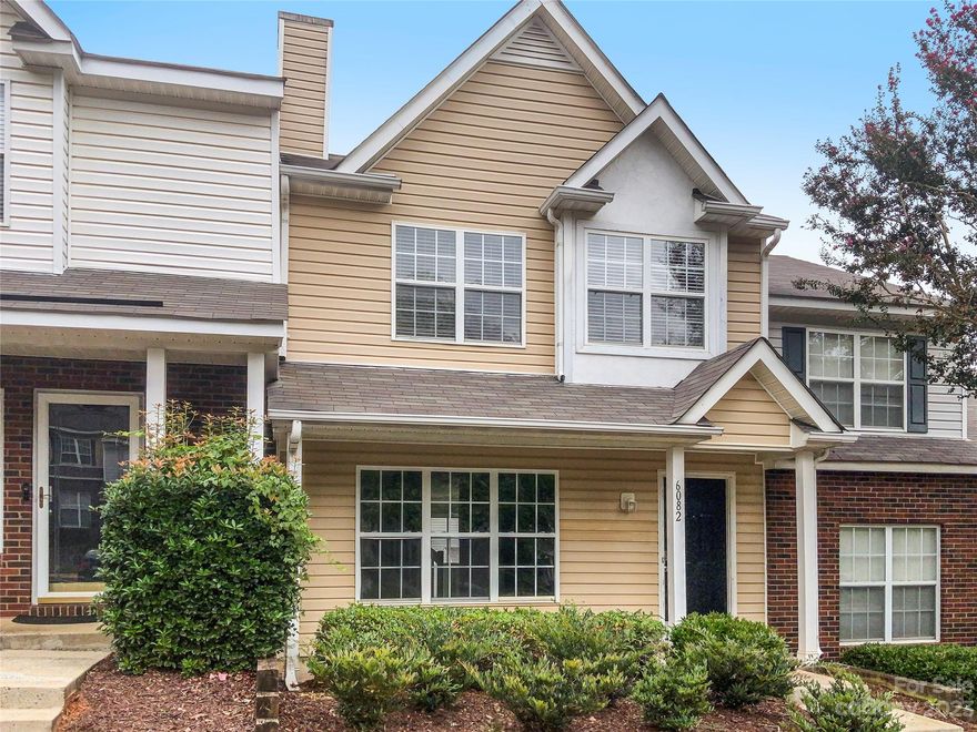 This charming towhome needs to be on your list of home visits.  This traditional floorplan features gorgeous wood look tile floors in the downstairs, an updated kitchen with an island, granite countertops and stainless appliances, large windows that let in a ton of natural light, spacious bedrooms  and a walkout patio.  Come take a look today!