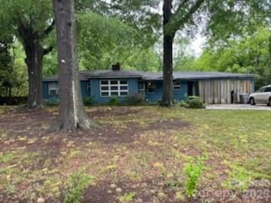 Incredible development opportunity in a prime Charlotte location! Located just 2.1 miles from Charlotte Douglas International Airport and easy access to I-485, Uptown Charlotte and the White Water Rafter Center. The close proximity to these key destinations gives it exceptional potential for builders, investors and developers looking to maximize the potential of land in a growing area of Charlotte. The property sits in a quiet, established neighborhood with no HOA. Potential uses for this versatile flat 2.64 acre include multi-family housing, subdividing for additional homes or single-family estate. Zoned N1A.  Feel free to walk the property. Home itself needs extensive work and can be viewed by appointment only. No survey on file..