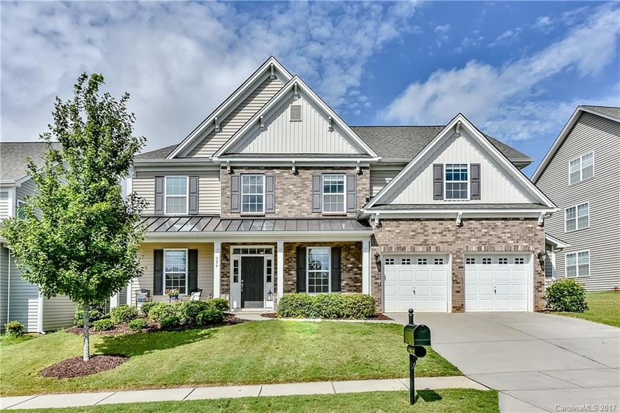 This Well Designed Beautiful Home has a Guest Bedroom with Private Full Bath on Main Floor. Great Use of Space in this family home.  Beautiful Hardwoods flow into Kitchen which is Open to Spacious Family Room with Fireplace. 
Four Spacious Bedrooms, Laundry Room AND ... A LARGE BONUS/PLAY ROOM are Upstairs. 
Beautiful Amenity Center,Olympic Size Pool with Slide,24 Hour Fitness Center,Tennis Courts,Playground,Walking Trails,Boating, Convenient to Shopping,Restaurants, Airport, Fort Mill Schools