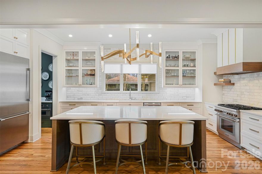 This lovely two-story custom home, built in 2023, has all the features of a custom builder's personal residence, built by Banister Homes, Inc. and a must-see fifteen minutes from uptown Charlotte.

This open floor plan, brick exterior home with an an oversized 2-car garage and shop, primary suite on main, has 5 large bedrooms with 5 private full baths, and 4 of the bedrooms have walk-in closets.  Property has a large fenced back yard with a covered rear porch with a fireplace and ceiling heaters, an outdoor kitchen and terrace, and a personal putting green.  

Family living areas include a custom kitchen with Thermador appliance package, separate scullery, large mud room with drop zone and walk-in coat closet, and a large den/billiard/music with doors to the patio.  

The home's energy features include tankless water heater, sealed crawl space, home power backup battery system with solar power, ensuring up to ninety percent lower electricity bills and backup in case of power outages, like a home generator with daily solar recharge.  Large primary suite on main with its own personal laundry, large dual closet and en-suite with zero curb double shower, water closet with bidet, and large dual vanity.  Upstairs has three additional bedroom/bath suites (one a bonus room), large family laundry, and comfort.  Tech features include built-in audio with individual volume controls for multiple spaces, home wiring closet, security system, three individual HVAC systems, and automated locks.