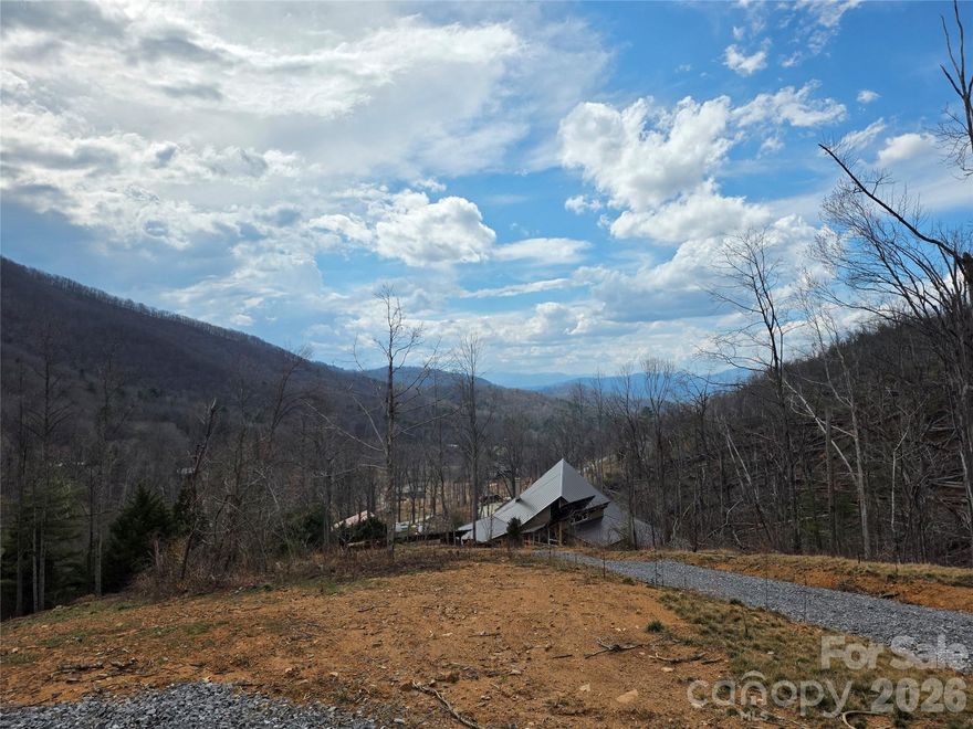 Awe inspiring North Asheville mountain view lot ready to build. Come and see this gorgeous, year-round, South facing, long range, layered, mountain view, lot overlooking Beaverdam valley! Easy access to the Blue Ridge Parkway, Asheville via Town Mountain Rd. and North Asheville via Beaverdam for Groceries, Shopping, Parks, Eateries and much more. Nature abounds in this location with the BRP and Town Mtn Rd under a mile North of this property at the top of the roadway. Webb Cove is a county maintained gravel roadway for about 1 mile up to the property. If you are looking for a nature retreat or second home with amazing South facing views this is the place for you. This lot has already been approved for a 4 bedroom septic and the driveway as well as initial tree removal have been completed. The seller is a licensed residential contractor available to design, develop, and build-to-suit should you want a custom home built. The driveway is shared with 2 neighboring lots however access and traffic in this area are very low and the location feels very private. Old Restrictive Covenants on file. No HOA, monthly dues, or current neighborhood association. Inquire within for more details.