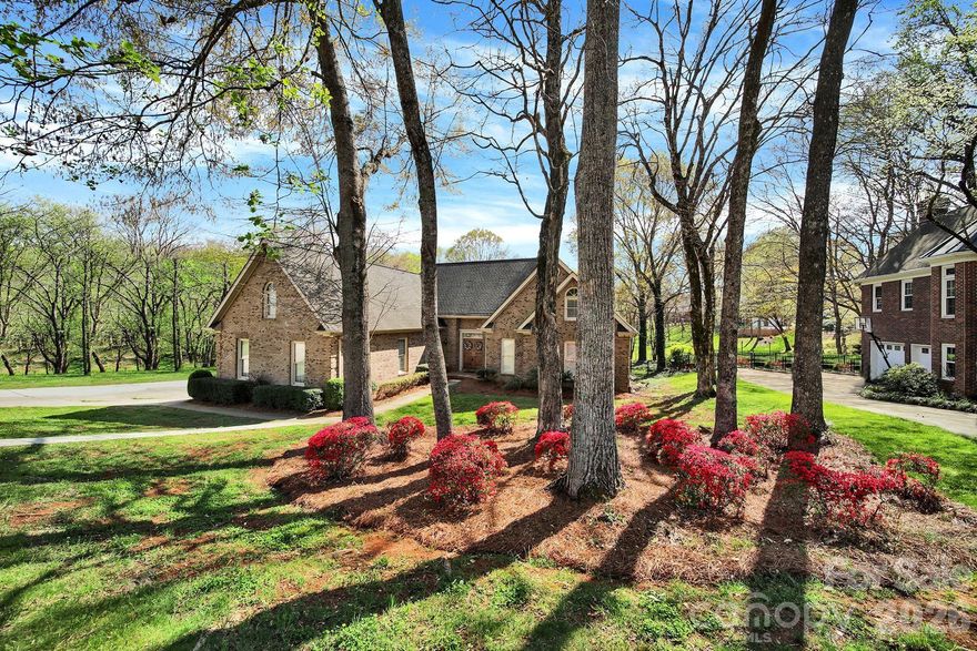 BACK ON MARKET!  You NOW get another chance at this amazing home! Located in highly sought-after Beacon Knoll and bordered by natural area on two sides, this exclusive all-brick side entry 2 car garage home offers 4 bedrooms, 3.5 bathrooms, and a flexible open floor plan designed for modern living. The oversized primary suite ideally on the main level provides convenience and privacy, while a main-level office (currently used as a bedroom) is ideal for remote work, guests, or flex space. The WOW factor is the open-concept kitchen featuring spacious island, tons of cabinetry and flows seamlessly into a sun-filled morning room with large windows, perfect for everyday living and entertaining. A sunken living room with tall ceilings and a wet bar adds architectural interest and creates a welcoming space for hosting gatherings. Finishing out the first floor is a half bathroom and the laundry area. Upstairs, features remaining bedrooms, each with individuality and the fourth bedroom/bonus room with a full bathroom offers a private retreat ideal for a 2nd Primary, guest suite, teen suite, or media room.  Walk-in attic with access from the bonus room provides incredible storage.  Don't wait - schedule your showing today!