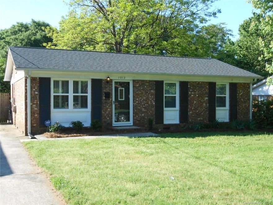 All brick home w/ 2 car garage, shed, privacy fenced yard, plantation shutters & original hrdwds. Tile in kitchen, laundry & bath. Fresh interior paint & brand NEW windows. SS appliances & under cabinet lights in kitchen. Large deck is ready for BBQ's! Lots of parking. Roof & gutters replaced 2011. Gas pack HVAC (2005) provides low utilities. On a city bus line. A doll house! No HOA. Convenient to Uptown, interstates & Airport. Move-in ready.