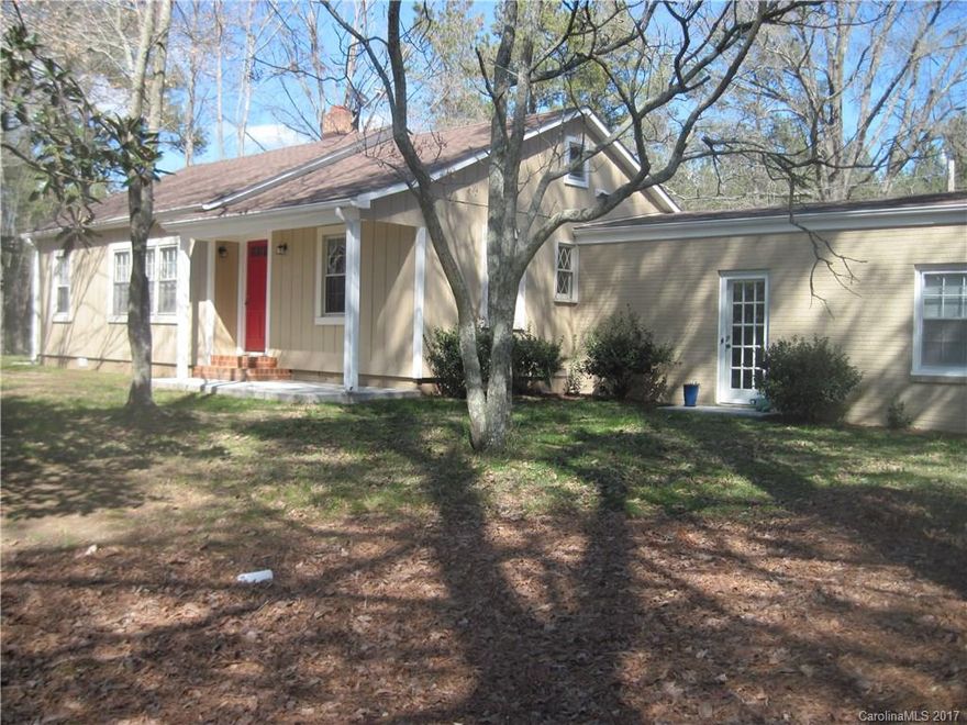 5 BEAUTIFUL PRIVATE WOODED ACRES boasts a remodeled ranch with plenty to offer. Hardwood floors, large great room with woodstove, huge sunroom overlooking fish pond and woods. Formal living room with fireplace, eat in kitchen and large laundry room/mud room. Large outbuilding needs TLC. Nice circular driveway and plenty of parking. New roof in 2014, new HW heater in 2016.