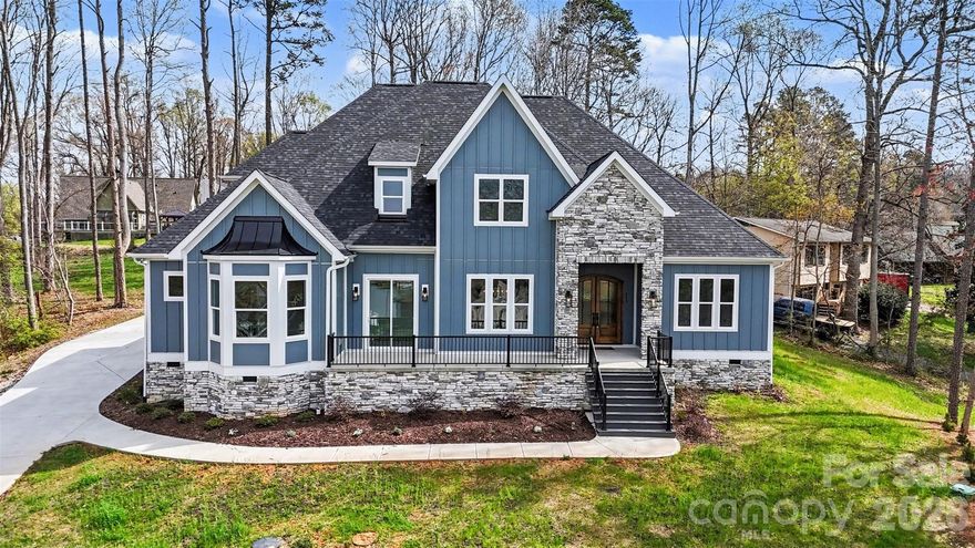 Experience elevated luxury living with year round Lake Norman water views in this stunning, expertly crafted new construction home in Shady Cove, showcasing exceptional attention to detail throughout. Completed in 2024, this exquisitely designed new construction residence offers over 4,000 square feet of refined living space with 4 bedrooms and 4 baths, blending timeless design with modern comfort.

The main level unfolds with an open, light filled layout that seamlessly connects the living, dining, and kitchen spaces, complemented by a private home office. At the heart of the home, the designer kitchen features premium appliances, an oversized island with leathered finish granite, custom cabinetry and a layout tailored for both effortless entertaining and everyday living.

The main level primary suite offers a private retreat, complete with a sitting area, direct access to a terrace overlooking the lake, and a spa inspired bath featuring an oversized walk in shower, soaking tub, and elegant finishes. Upstairs, generously sized secondary bedrooms and an oversized versatile multi purpose room provide flexibility for guests, work, or leisure.

Outdoor living is equally inviting with a covered patio and 2 minutes to Safe Harbor Skippers Landing Marina, offering easy access to Lake Norman. Situated on a .57 acre homesite with no HOA and a 3 car garage, this home combines privacy, space, and convenience just minutes to Mooresville.

A rare offering that captures the essence of Lake Norman living. Preferred lender offering lender credits toward closing costs.