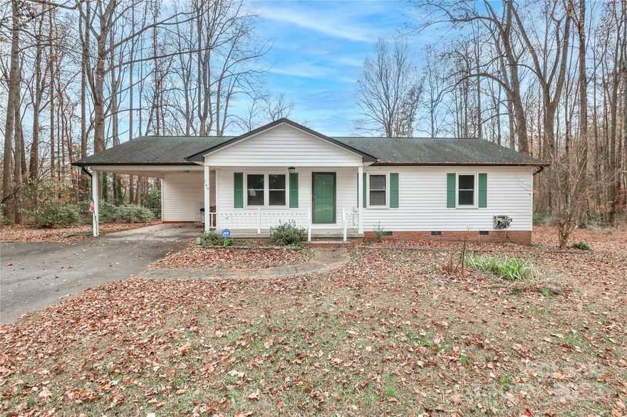 If you are looking for adorable you've come to the right place.  This home with nearly 1500 sq/ft features large open living area adjoining kitchen with painted cabinets and butcherblock counter tops. Decorative SS exhaust hood and appliances finish off the look. Located on a quiet country road you'll enjoy the privacy of life on your rocking chair front porch or sunroom overlooking the fenced backyard. Both bathrooms with updated vanities add to the ambiance. Can't beat the value at this price. Set up your showing today.