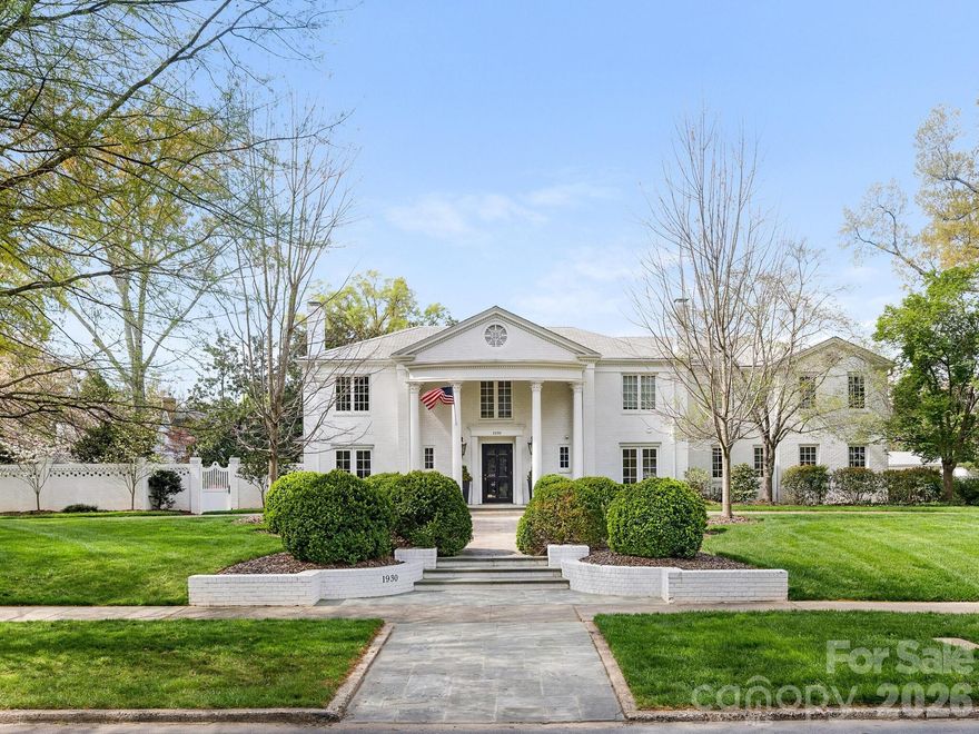 This classic home in sought after Myers Park is on a rare double lot that is just under one acre. The 7,300 sq ft main house includes 6 bedrooms, 5 full baths, and 3 half baths. Scullery located off of kitchen with additional refrigerator and plenty of storage.  Guest/Pool house built in 2021 features 1 bedroom, 1.5 baths, a full kitchen, and an upstairs gym overlooking professionally landscaped rear yard and gardens. Gracious formal areas, high ceilings, hardwood floors, crown molding, custom built-ins, and marble finishes. Large windows provide great natural light and views of treelined Queens Road West and the beautiful outdoor spaces.   Covered outdoor sitting area with fireplace and additional dining area.  The home has amazing outdoor living complete with pool, spa, and multiple entertaining spaces including expansive lawn with turf and gazebo. 2 car garage with ample additional parking and circular drive. Control 4 system. Elevator. First and second floor laundry locations. Close to retail, shops and nearby Freedom Park.