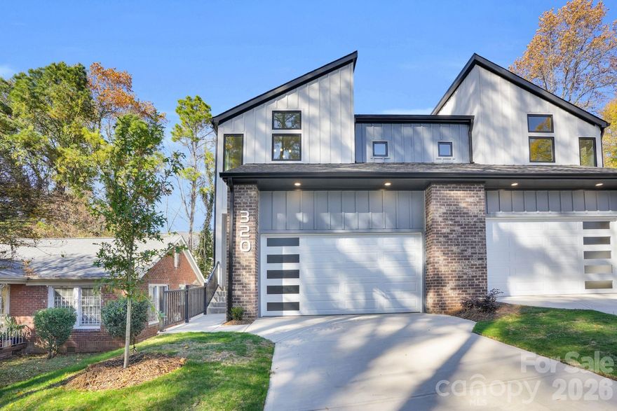 Experience elevated urban living in this stunning, walkable townhome just steps from the streetcar, Rhino Market, Towne Brewing and Stewart Creek Greenway in sought-after Wesley Heights. Built by Johnston Brothers Homes, this residence lives like a single-family home—with the rare advantage of no HOA fees.

Inside, an expansive open-concept floorplan welcomes you with refined finishes and thoughtful design. The chef’s kitchen is the heart of the home, featuring a large island with seating, custom cabinetry, quartz countertops, a premium KitchenAid appliance package, and a separate scullery—perfect for effortless morning coffee prep!

The spacious living area is designed for comfort and style, showcasing a gas fireplace, custom built-ins, and a sleek wet bar with wine cooler. Oversized 12-foot glass slider doors flood the space with natural light and open seamlessly to a covered porch and fenced yard—creating the ultimate indoor-outdoor lifestyle. 

Upstairs, the primary suite offers a true retreat with vaulted ceilings, expansive windows, and a spa-inspired bathroom complete with multiple shower heads, illuminated mirrors, dual vanities, and a custom walk-in closet with wood shelving. Secondary bedrooms continue the elevated feel with high ceilings, abundant light, and skyline views.

Enjoy premium standard upgrades from JBH, including a tankless water heater, black aluminum-clad casement windows, designer lighting and plumbing fixtures, and a 10-year home warranty.

All of this just minutes from Uptown and South End’s top dining, shopping, and entertainment—while tucked into the quiet charm of Wesley Heights. Ask agent about financing through builders lender.