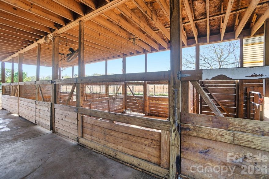 You’ve been dreaming of a farm, here’s your opportunity. Welcome home to 5727 S. Rocky River Rd. this wonderful piece of property has many versatile uses. In the past, it’s been a home, a llama farm and an animal rescue. Now it’s waiting for your dream! And it has fencing! NO HOA

Once you pull off the road, it’s hard to believe the awesomeness that lies ahead. As you pass through the gate, you will see a two stall barn with an attached office. The office features heating and cooling. Once outside, you will notice the charming tool shed and the metal utility building. Both of these have many options for usage.

The glorious 48 x 48 metal barn is open on three sides and contains (6) 12 x 12 stalls with thermostat controlled fans. There is a heated and cooled office with a shower. The feed/tack room is large and has stairway access to the massive hayloft. Conveniently located on each corner of the barn is water access. There’s also a water line run out to the rear pasture (right?!) County water is available and connected.

The majority of the 9 acres is cleared (7.2) and fenced! The remaining acreage is a small hardwood grove at the right rear corner of the parcel. There are currently five pastures and one dry lot. The owners have been told that the property is sub dividable. No septic permit is on file though one has been discussed in the past.
Bring your horses, roosters, loud peacocks, whatever your heart desires and make this place your home