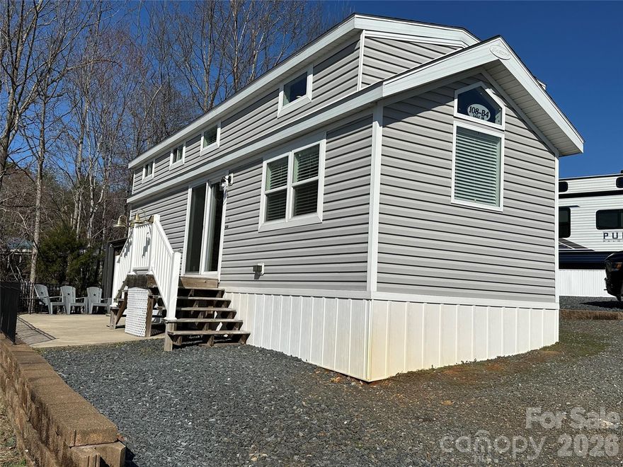 Enjoy easy lake living with this 2021 park model home featuring modern finishes and a front kitchen floor plan with beautiful cream cabinetry. This well-designed home offers 1 bedroom plus a spacious loft, providing additional sleeping space for family and guests. The bedroom includes built-in storage, maximizing functionality and comfort. Outside, you’ll find a concrete pad for low-maintenance living, while the gazebo creates the perfect spot for grilling, relaxing, or gathering with friends and family. Located inside the gated waterfront community of Badin Shores Resort, you’ll enjoy access to fantastic amenities and the laid-back lifestyle that makes lake living so special.