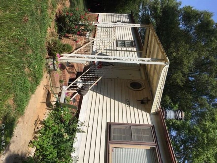 Three bedroom two bathroom double wide in a great location to Charlotte and Ballantyne. New stove, refrigerator and dishwasher.  Roof, siding and shingles new 2012. Heat and Air is electric.  New front and back doors.  Must see, great lot in community  Owner will finance with good offer.  Nice porches on from and back, private back yard